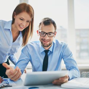 Image of two successful business partners working at meeting in office